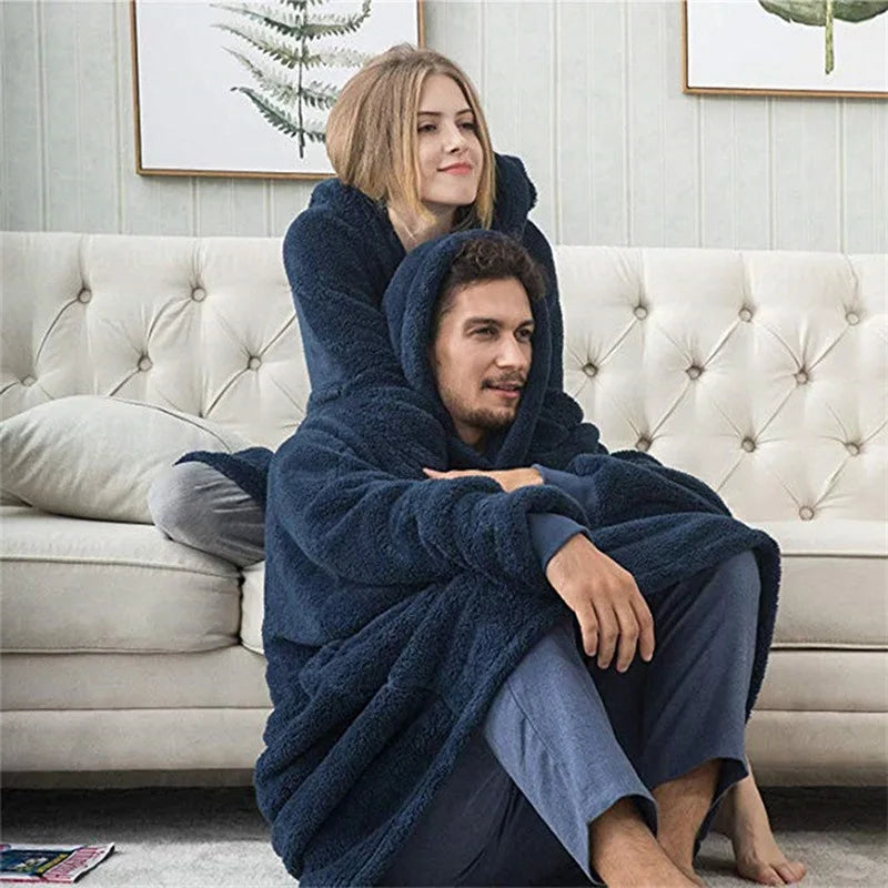 Couple staying warm on the sofa